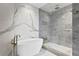 Spa-like bathroom with a freestanding soaking tub and a glass-enclosed shower at 2912 W Santiago St # 1703, Tampa, FL 33629