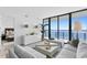 Living room with stunning water views and modern decor at 2912 W Santiago St # 1703, Tampa, FL 33629