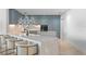 Modern kitchen with light blue cabinets and marble countertops at 2912 W Santiago St # 1703, Tampa, FL 33629