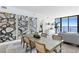 Bright dining room with water views and modern art at 2912 W Santiago St # 1703, Tampa, FL 33629