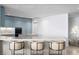 Modern kitchen with light blue cabinets and marble countertop at 2912 W Santiago St # 1703, Tampa, FL 33629