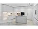 Modern kitchen with white cabinets and marble countertops at 2912 W Santiago St # 903, Tampa, FL 33629