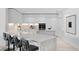 Modern kitchen with white cabinets, marble countertops, and island at 2912 W Santiago St # 903, Tampa, FL 33629