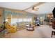 Spacious living room with comfy seating, large windows and a ceiling fan at 7131 El Dewitt St, Zephyrhills, FL 33541