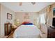 Bright bedroom with a comfortable bed and plenty of light at 7131 El Dewitt St, Zephyrhills, FL 33541