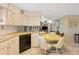 Bright kitchen features ample cabinetry, a dishwasher, and a convenient breakfast bar at 7131 El Dewitt St, Zephyrhills, FL 33541