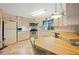 Galley style kitchen with stainless steel appliances and ample counter space at 7131 El Dewitt St, Zephyrhills, FL 33541