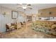 Spacious living room with a comfortable sofa and open floor plan at 7131 El Dewitt St, Zephyrhills, FL 33541