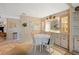 Bright dining area with built-in hutch and a round dining table at 7131 El Dewitt St, Zephyrhills, FL 33541