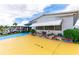 Mobile home exterior with unique driveway and landscaping at 7131 El Dewitt St, Zephyrhills, FL 33541