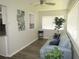 Bright living room with hardwood floors and a comfy couch at 1306 Idlewood Dr # 53, Sun City Center, FL 33573