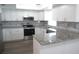 Modern kitchen with granite countertops and stainless steel appliances at 1306 Idlewood Dr # 53, Sun City Center, FL 33573