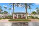 Elegant community clubhouse with palm trees at 1306 Idlewood Dr # 53, Sun City Center, FL 33573