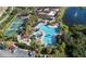 Community pool, tennis courts, and clubhouse at 1306 Idlewood Dr # 53, Sun City Center, FL 33573