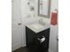 Clean bathroom with dark vanity and marble top at 1306 Idlewood Dr # 53, Sun City Center, FL 33573