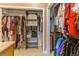 Large walk-in closet with ample hanging and shelving space at 2476 Grove Ridge Dr, Palm Harbor, FL 34683