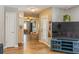 View of living room and entryway with wood floors at 2476 Grove Ridge Dr, Palm Harbor, FL 34683