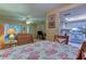 Dining area with kitchen access, floral tablecloth and wooden chairs at 3283 Hilary Cir # 2C, Palm Harbor, FL 34684