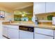 Kitchen features wood countertops, white cabinets, and a built-in dishwasher at 3283 Hilary Cir # 2C, Palm Harbor, FL 34684