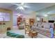 Living room with open floor plan, comfortable seating, and ceiling fan at 3283 Hilary Cir # 2C, Palm Harbor, FL 34684