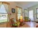Sunroom offers a relaxing space with wicker chairs, window seating, and natural light at 3283 Hilary Cir # 2C, Palm Harbor, FL 34684