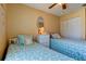 Bedroom featuring two twin beds and ample closet space at 3283 Hilary Cir # 2C, Palm Harbor, FL 34684