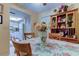 Charming dining area with floral tablecloth and kitchen view at 3283 Hilary Cir # 2C, Palm Harbor, FL 34684