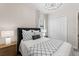 Cozy bedroom featuring neutral colors, stylish furnishings, and a tufted headboard for a luxurious feel at 10385 Sunday Dr, Port Charlotte, FL 33981