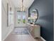 Welcoming foyer with modern decor, stylish lighting, and a view of the front entrance at 10385 Sunday Dr, Port Charlotte, FL 33981