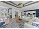 Bright living room with open floor plan and views of the entry, kitchen, and dining areas, perfect for entertaining at 10385 Sunday Dr, Port Charlotte, FL 33981