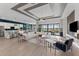 Open-concept living room with modern decor, seamlessly connected to the kitchen and dining area at 10385 Sunday Dr, Port Charlotte, FL 33981