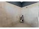 Neutral-toned tiled shower with shelving for toiletries and a shower head at 10385 Sunday Dr, Port Charlotte, FL 33981