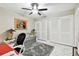 Home office with a gray couch and built-in closet at 14135 Cypress Cir, Tampa, FL 33618