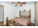 Bedroom with ornate bed frame and ceiling fan at 2320 E 12Th Ave, Tampa, FL 33605