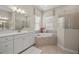 Elegant bathroom with a soaking tub and walk-in shower at 10386 Calumet Blvd, Port Charlotte, FL 33981