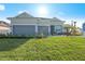 Beautiful house exterior with two-car garage and landscaped yard at 10386 Calumet Blvd, Port Charlotte, FL 33981