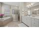 Spa-like bathroom with soaking tub and double vanity at 10386 Calumet Blvd, Port Charlotte, FL 33981