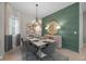 Elegant dining room with a statement wall and modern light fixture at 10386 Calumet Blvd, Port Charlotte, FL 33981