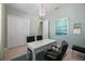 Well-lit home office with built-in storage and window at 10386 Calumet Blvd, Port Charlotte, FL 33981
