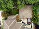 House and garage with brown roofs and a red car at 3104 W Fielder St, Tampa, FL 33611