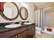 Bathroom features double vanity, granite countertops, and a bathtub at 3104 W Fielder St, Tampa, FL 33611