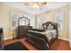 Bright bedroom with hardwood floors and a large dresser at 3104 W Fielder St, Tampa, FL 33611