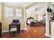 Spacious bedroom with hardwood floors and an attached office at 3104 W Fielder St, Tampa, FL 33611