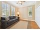 Relaxing bedroom with hardwood floors, neutral walls, and plantation shutters at 3104 W Fielder St, Tampa, FL 33611