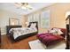 Bedroom with hardwood floors and a cozy seating area at 3104 W Fielder St, Tampa, FL 33611