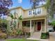 Two-story home with a red door and landscaping at 3104 W Fielder St, Tampa, FL 33611