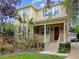Two-story home with a red door and landscaping at 3104 W Fielder St, Tampa, FL 33611