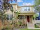 Two-story home with a red door and landscaping at 3104 W Fielder St, Tampa, FL 33611