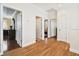 Bright hallway with hardwood floors and access to bedrooms at 3104 W Fielder St, Tampa, FL 33611