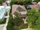 Two-story home with brown roof, surrounded by lush greenery at 3104 W Fielder St, Tampa, FL 33611